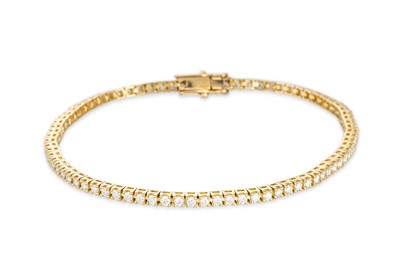 Lot 264 - A DIAMOND LINE BRACELET, the brilliant cut...