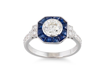 Lot 283 - A DIAMOND AND SAPPHIRE CLUSTER RING, of...