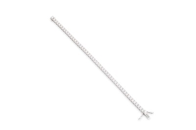 Lot 284 - A DIAMOND LINE BRACELET, the brilliant cut...