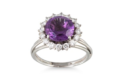 Lot 207 - AN AMETHYST AND DIAMOND CLUSTER RING, the...