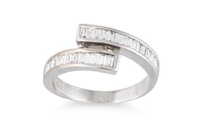 Lot 211 - AN EMERALD CUT DIAMOND RING, of crossover...