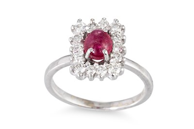 Lot 212 - A RUBY AND DIAMOND CLUSTER RING, the cabochon...