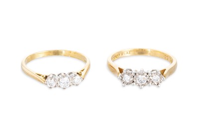 Lot 228 - TWO THREE STONE DIAMOND RINGS, mounted in 18ct...