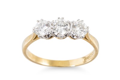 Lot 264 - A DIAMOND THREE STONE RING, mounted in 18ct...