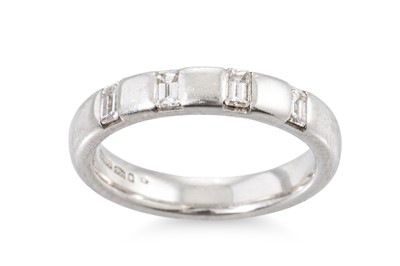 Lot 428 - A DIAMOND RING, the baguette diamonds set into...