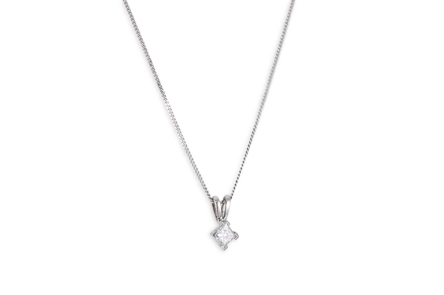 Lot 9 - A DIAMOND SET PENDANT, the princess cut...