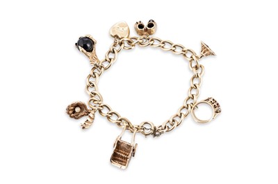 Lot 49 - A 9CT YELLOW GOLD CHARM BRACELET, set with...