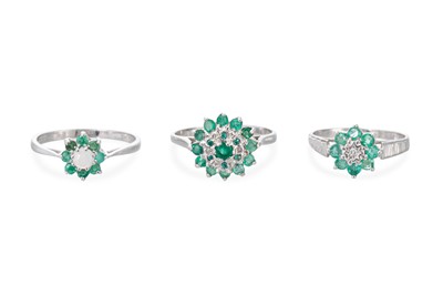 Lot 73 - AN EMERALD AND STONE SET CLUSTER RING, the...
