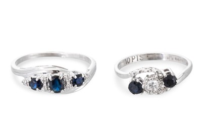 Lot 127 - A SAPPHIRE AND DIAMOND THREE STONE RING, of...