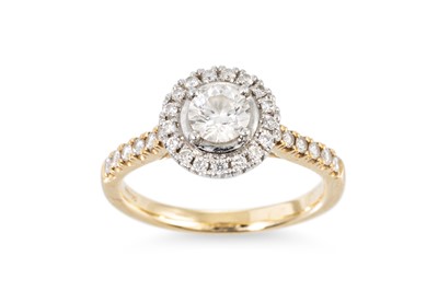 Lot 349 - A DIAMOND HALO STYLE CLUSTER RING, the central...