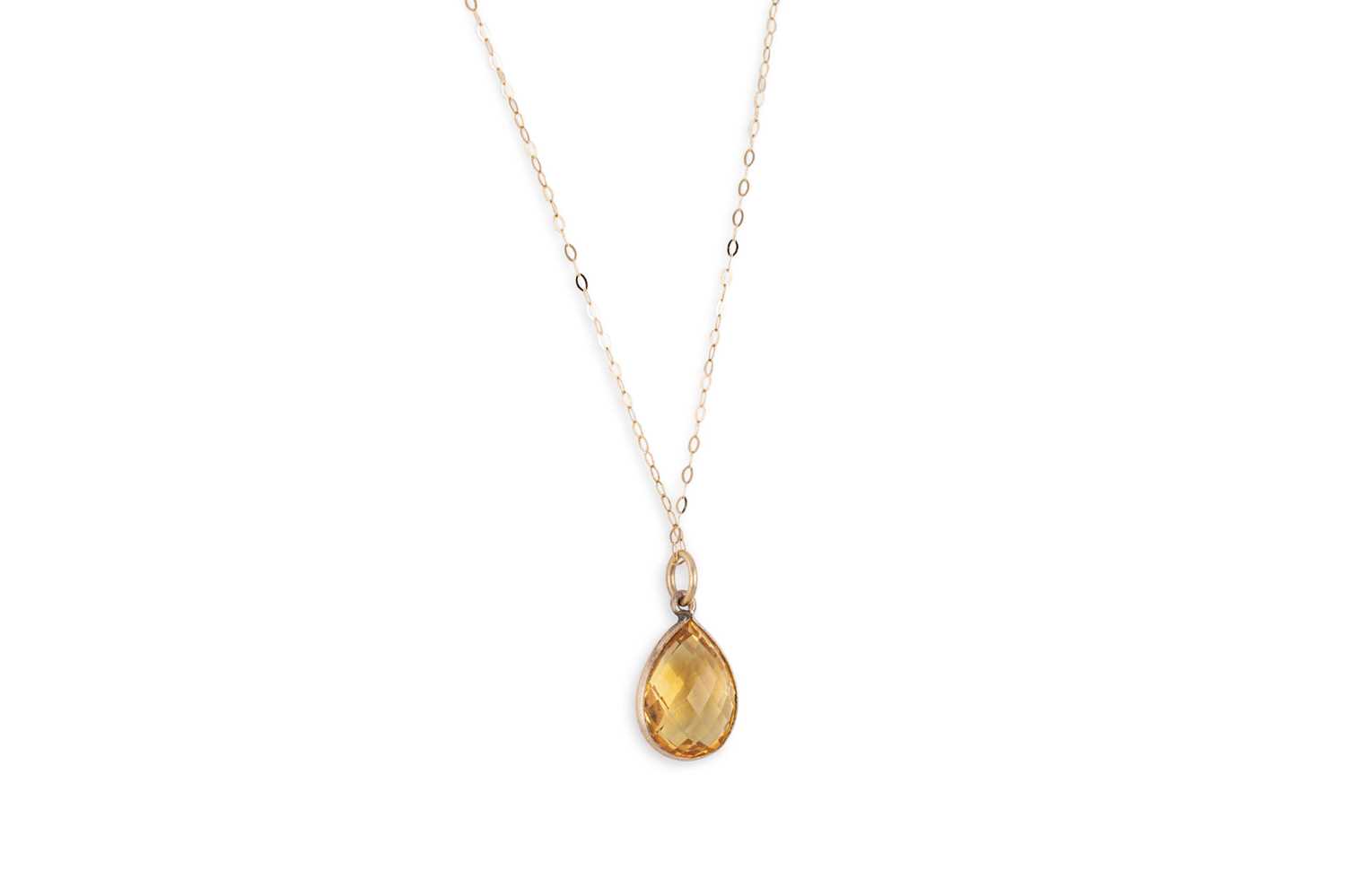 Lot 15 - A CITRINE PENDANT, the mixed pear cut citrine...