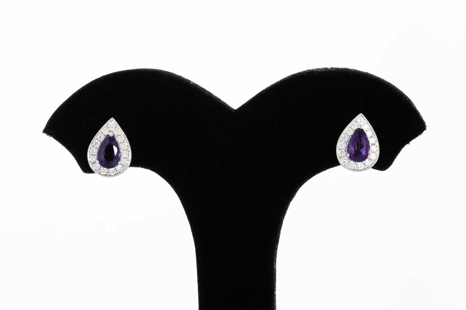 Lot 40 - A PAIR OF DIAMOND AND AMETHYST CLUSTER...