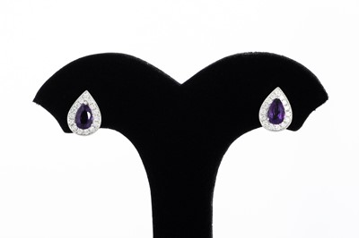 Lot 40 - A PAIR OF DIAMOND AND AMETHYST CLUSTER...