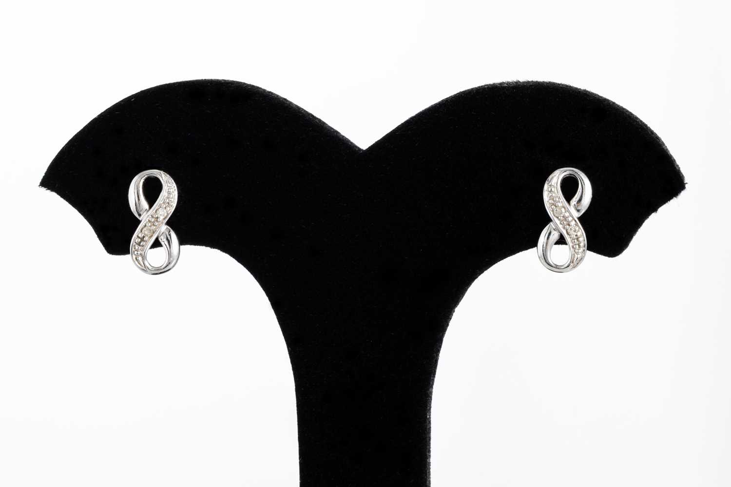 Lot 43 - A PAIR OF DIAMOND SET EARRINGS, in the form of...
