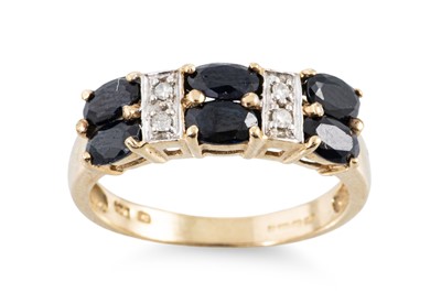 Lot 132 - A DIAMOND AND SAPPHIRE CLUSTER RING, the oval...