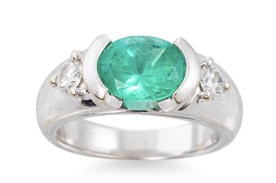 Lot 380 - AN EMERALD AND DIAMOND RING, the oval emerald...