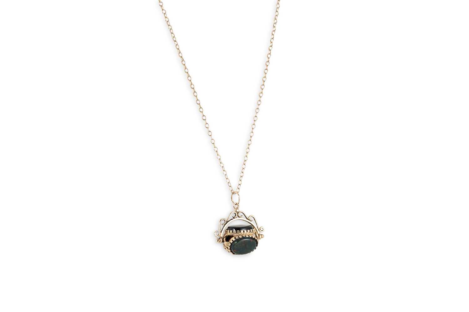 Lot 94 - A 9CT GOLD SWIVEL FOB PENDANT, hardstone set,...