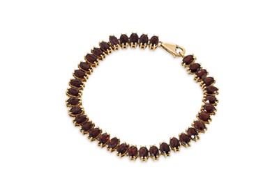 Lot 422 - A GARNET SET BRACELET, mounted in unmarked...