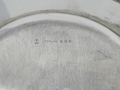 Lot 545 - A PAIR OF MID-20TH-CENTURY USA CIRCULAR SILVER...