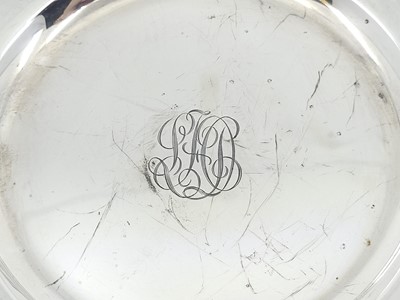 Lot 545 - A PAIR OF MID-20TH-CENTURY USA CIRCULAR SILVER...
