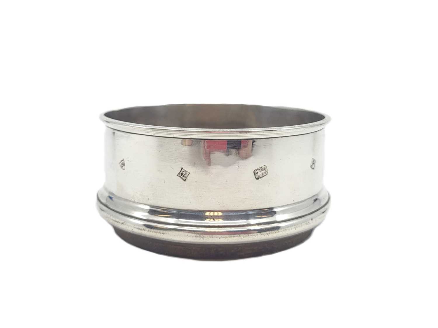 Lot 551 - A MODERN CIRCULAR STERLING SILVER (.925) WINE...