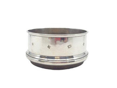 Lot 551 - A MODERN CIRCULAR STERLING SILVER (.925) WINE...