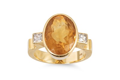 Lot 425 - A CITRINE AND DIAMOND SET RING, the bezel set...