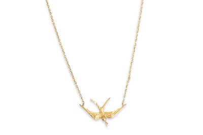Lot 343 - A VINTAGE SWALLOW PENDANT, to a gold back...