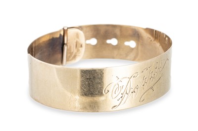 Lot 344 - A VINTAGE 9CT GOLD BUCKLE BANGLE, 17.35 g.