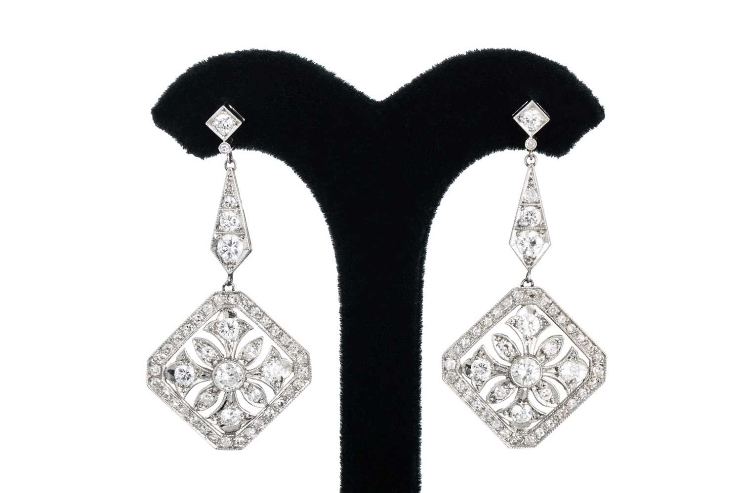 Lot 83 - A PAIR OF DIAMOND DROP EARRINGS, the round...