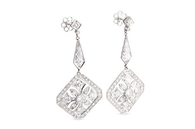 Lot 83 - A PAIR OF DIAMOND DROP EARRINGS, the round...