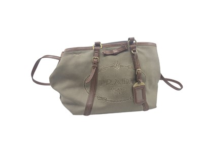 Lot 558 - A PRADA JACQUARD CANVAS AND BROWN LEATHER LADY'...