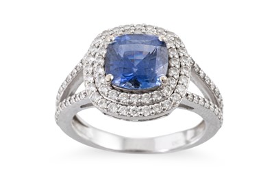 Lot 372 - A TANZANITE AND DIAMOND CLUSTER RING,  the...