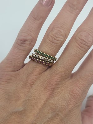 Lot 86 - THREE GEM SET STACKABLE RINGS, one set with...