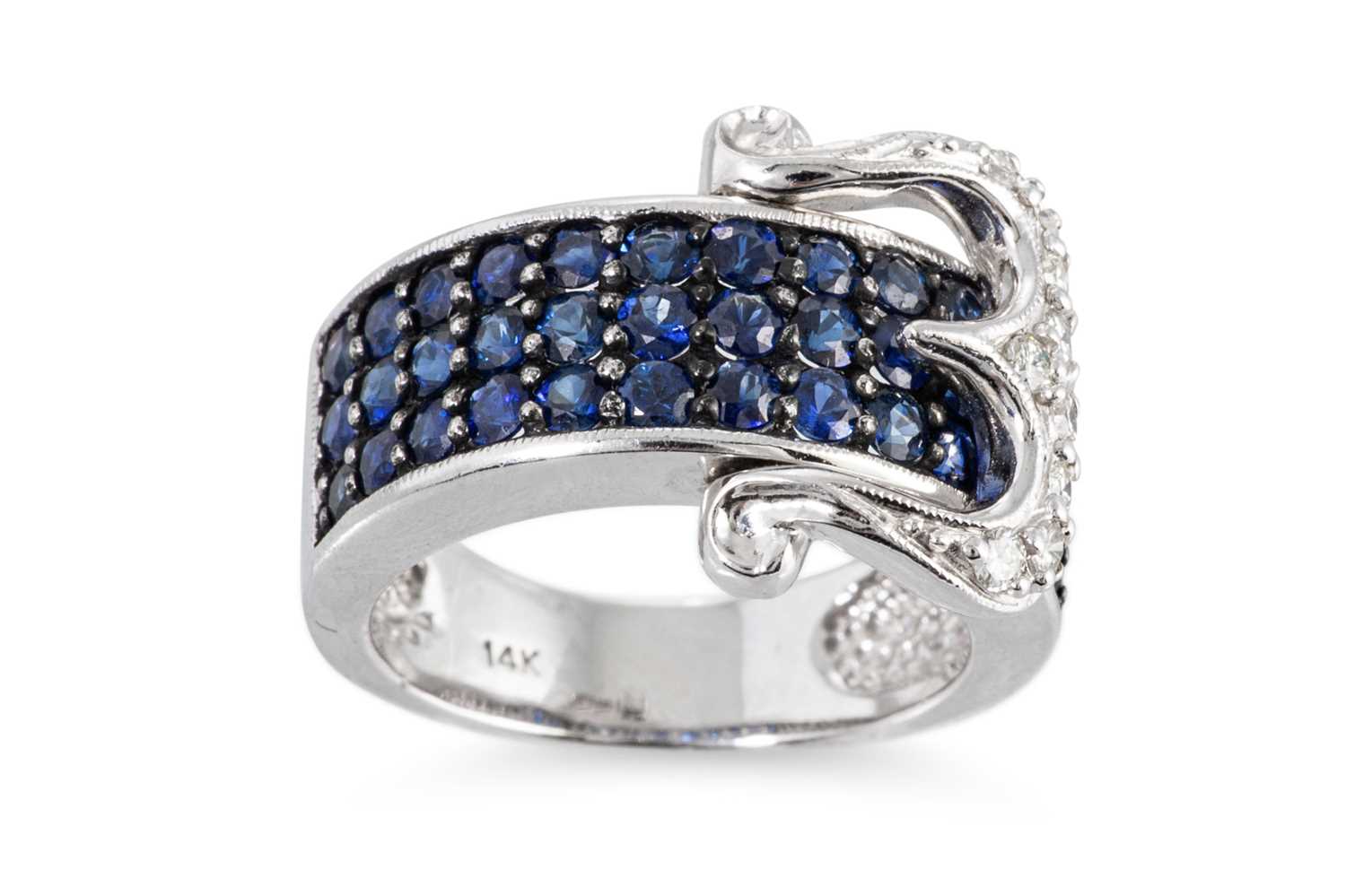 Lot 87 - A SAPPHIRE AND DIAMOND BUCKLE STYLE RING, the...