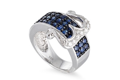 Lot 87 - A SAPPHIRE AND DIAMOND BUCKLE STYLE RING, the...