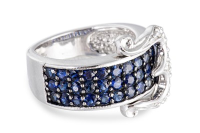 Lot 87 - A SAPPHIRE AND DIAMOND BUCKLE STYLE RING, the...