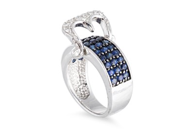 Lot 87 - A SAPPHIRE AND DIAMOND BUCKLE STYLE RING, the...