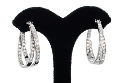Lot 61 - A PAIR OF DIAMOND SET HOOP EARRINGS, of cross...