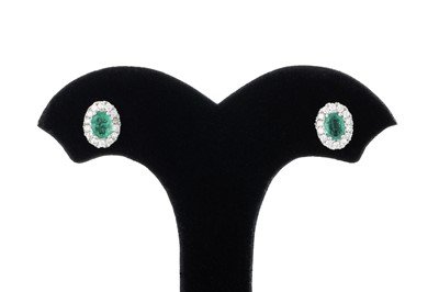Lot 62 - A PAIR OF EMERALD AND DIAMOND CLUSTER EARRINGS,...