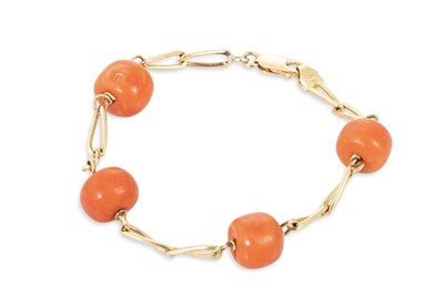 Lot 65 - A BEADED CORAL AND YELLOW GOLD BRACELET, the...