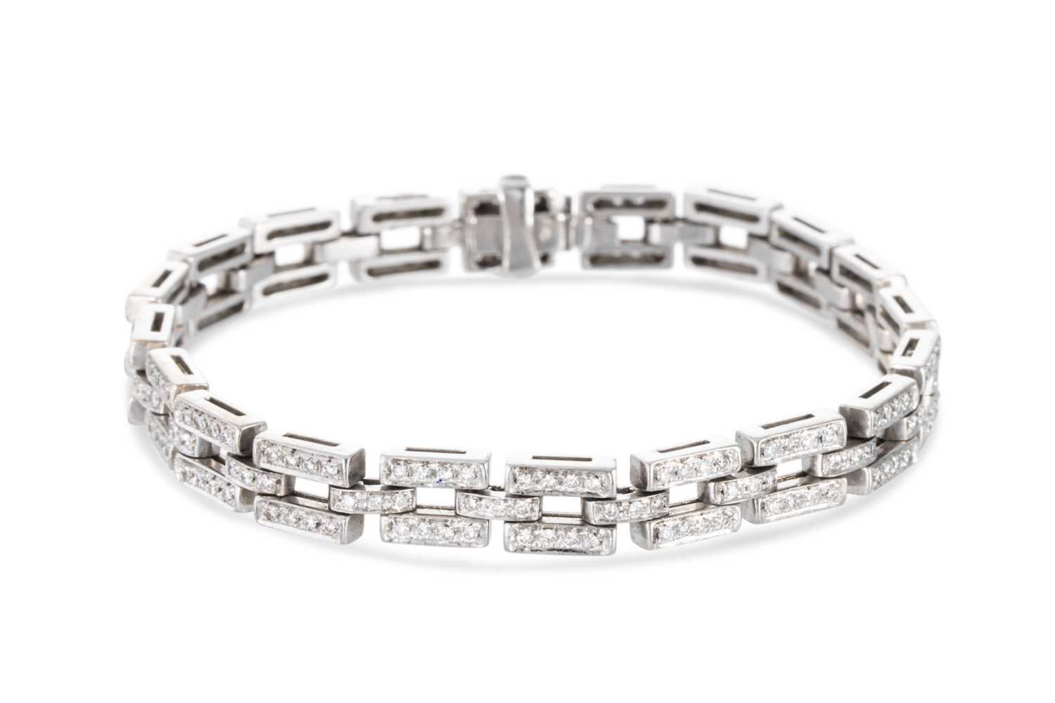 Lot 66 - A DIAMOND BRICK LINK BRACELET, the round cut...