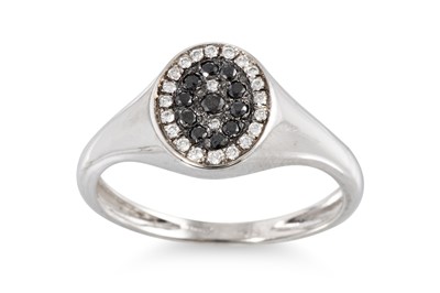 Lot 313 - A BLACK AND WHITE DIAMOND CLUSTER RING, signet...