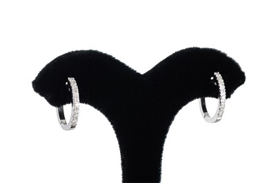 Lot 314 - A PAIR OF DIAMOND HOOP EARRINGS, the pavé set...
