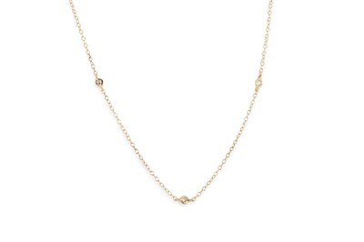 Lot 315 - A DIAMOND SET NECKLACE, the bezel set round...