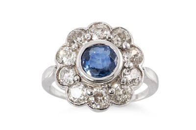 Lot 317 - A SAPPHIRE AND DIAMOND CLUSTER RING, the...