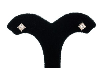 Lot 250 - A PAIR OF DIAMOND STUD EARRINGS, the round...
