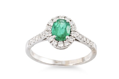 Lot 328 - AN EMERALD AND DIAMOND CLUSTER RING, the...