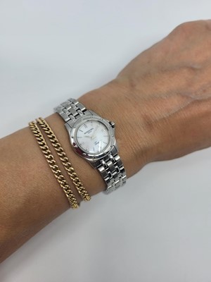 Lot 442 - A RAYMOND WEIL TANGO WRIST WATCH, mother of...