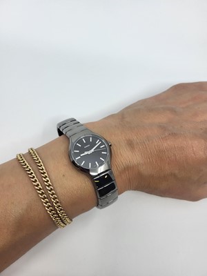 Lot 444 - A LADY'S RADO CERAMIC WRIST WATCH, black dial...
